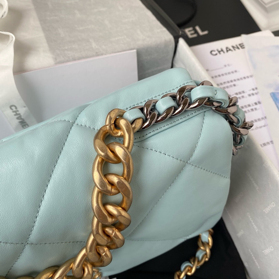 close up of gold hardware of chanel 19 handbag