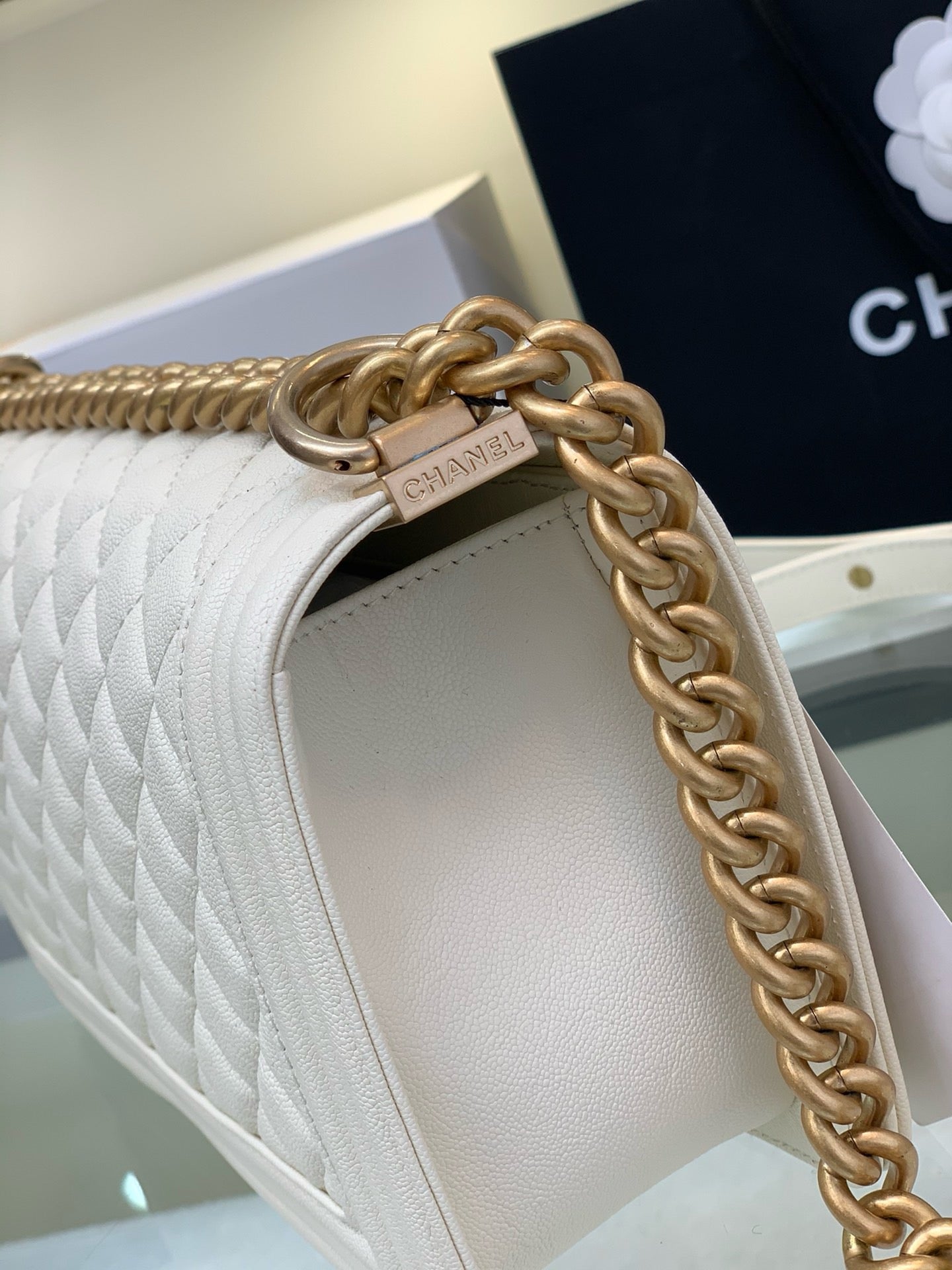 Side of White boy chanel bag calf skin gold hardware