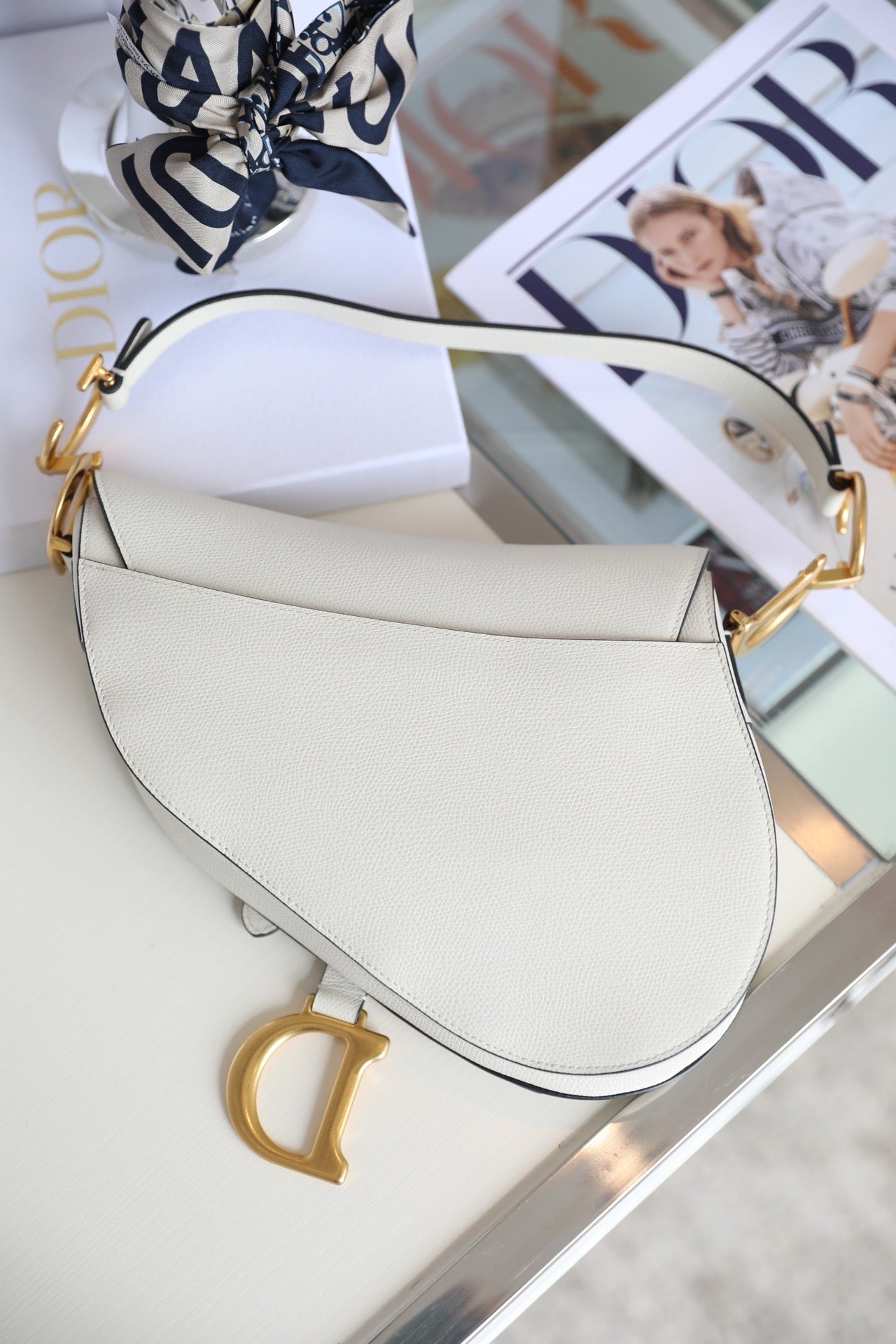 Back of White Dior saddle calf skin bag vintage gold hardware 