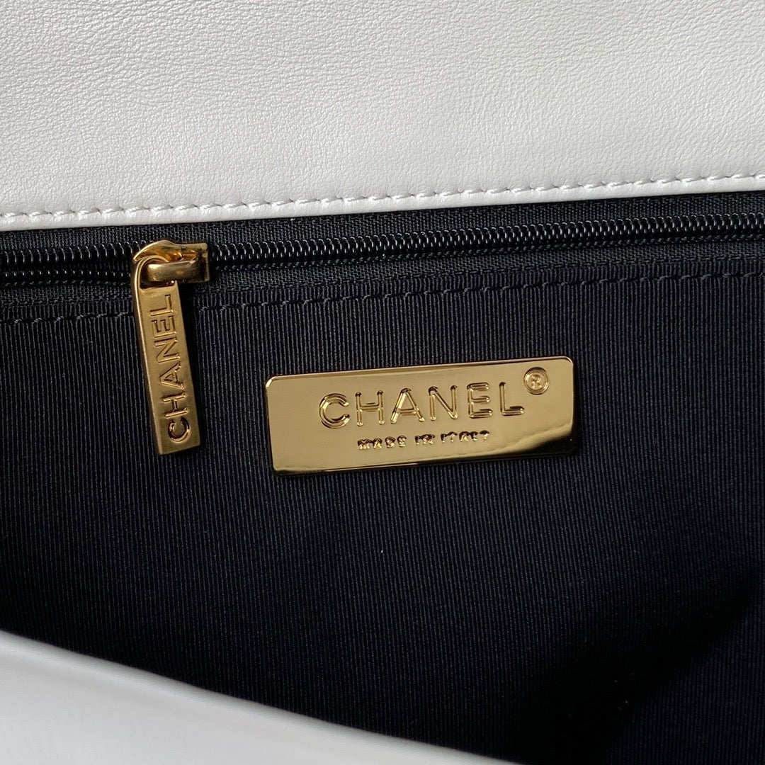 gold chanel logo inside white chanel 19 handbag in silver hardware lamb skin