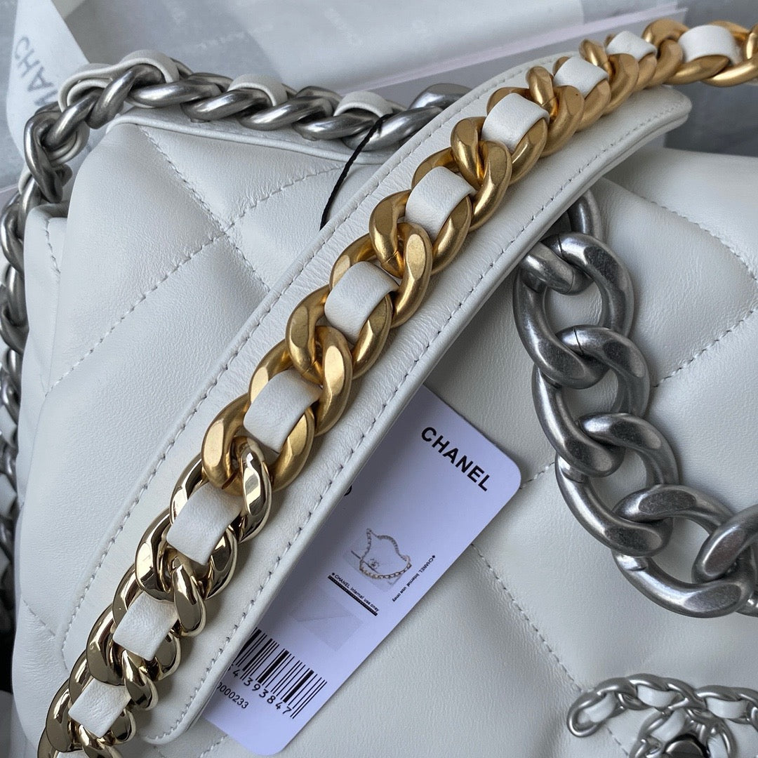 gold and silver chain strap of white chanel 19 handbag in silver hardware lamb skin