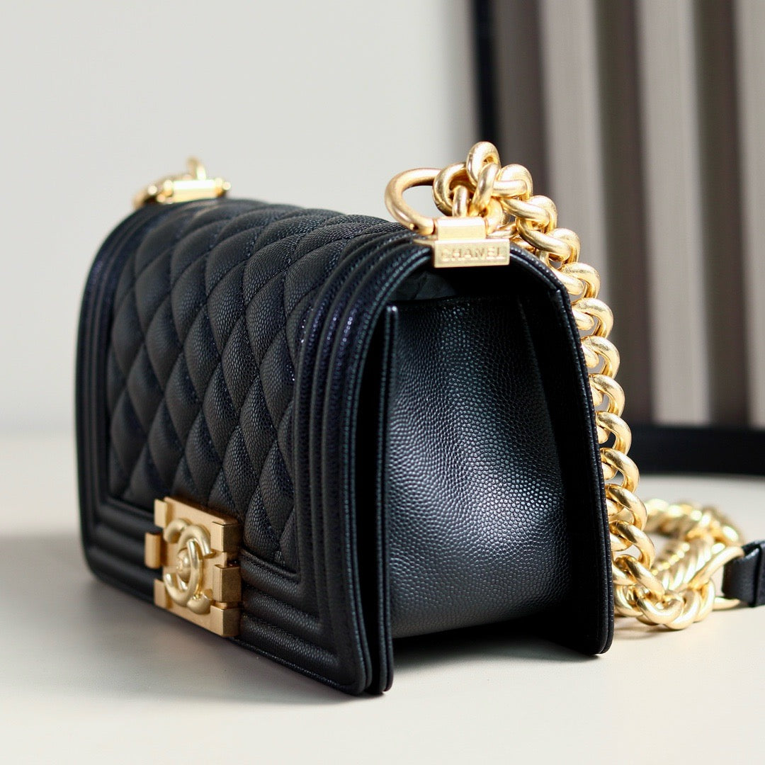 side of small black boy chanel bag calf skin