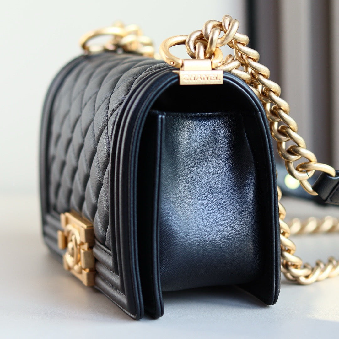 Side of small black boy chanel bag calf skin