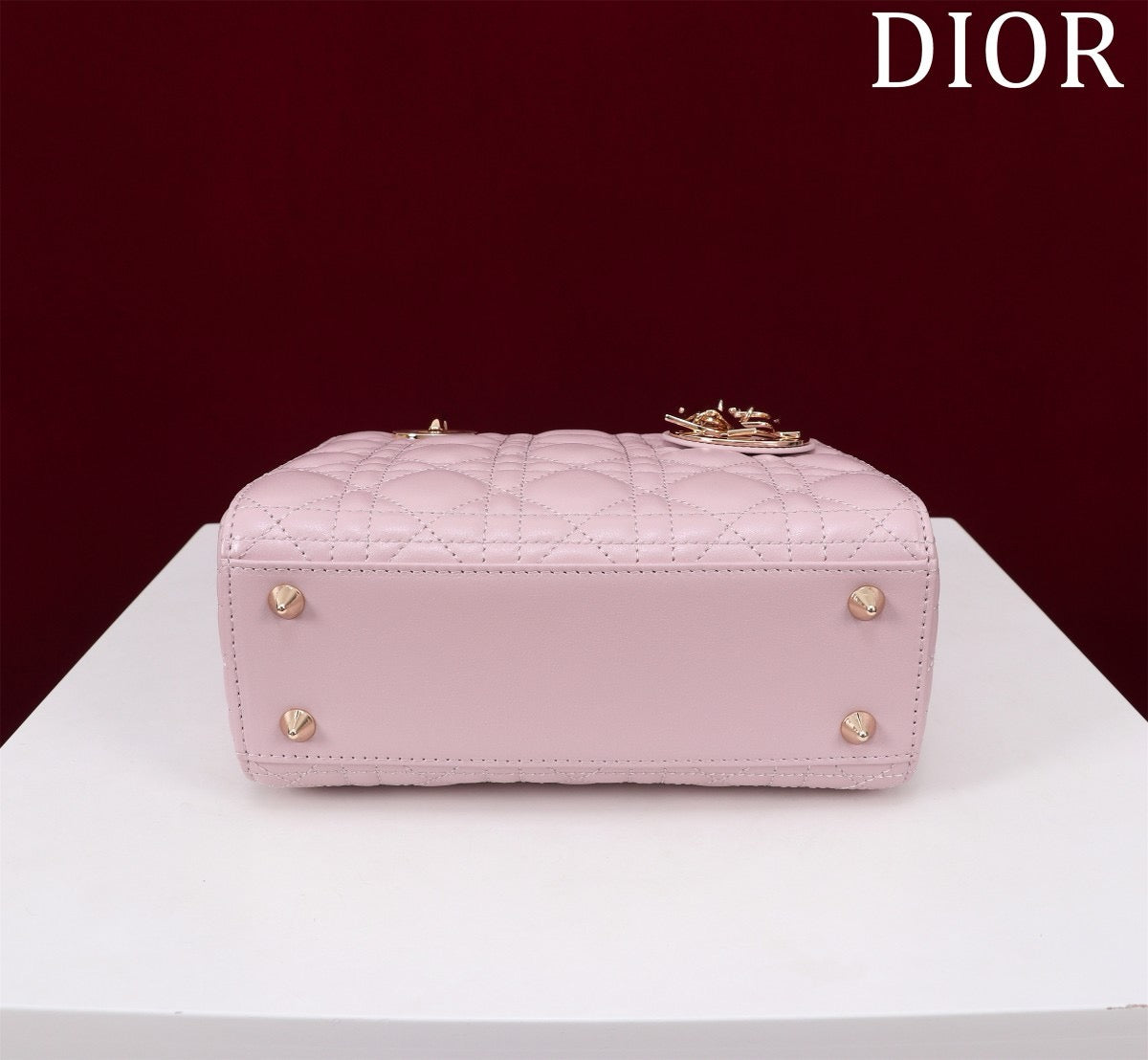 bottom view of pink lamb skin lady dior bag