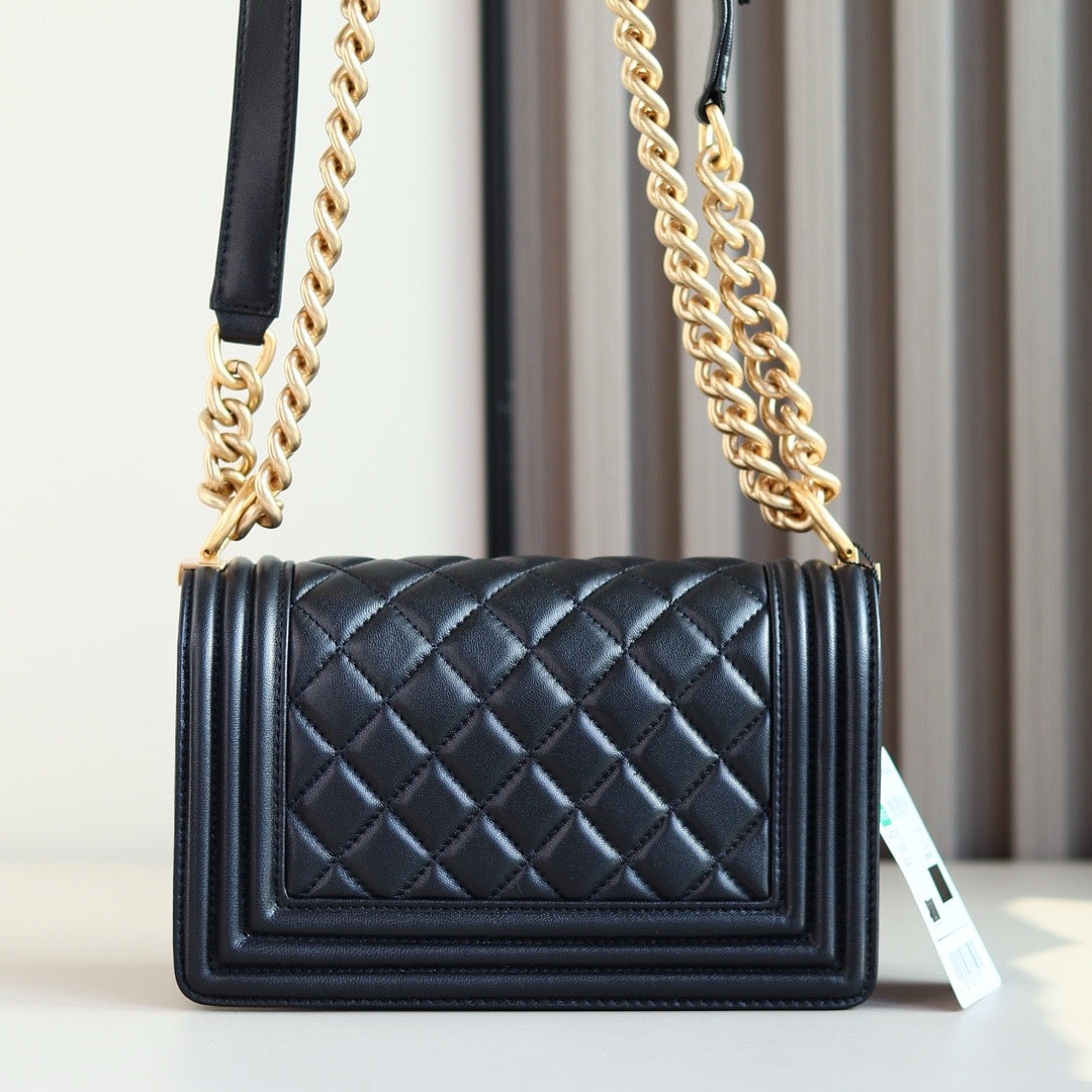 Back of black boy chanel bag gold hardware